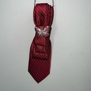 Elegant Red Tie with Butterfly Brooch